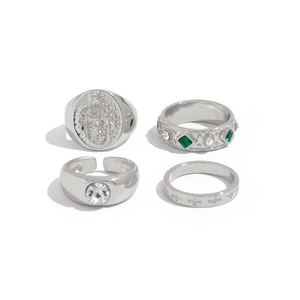 Retro baroque silver ring set with lion crest, green gemstones and cross motif