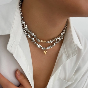 Two-layer silver beaded necklace set with gold heart pendant and irregular metallic accents