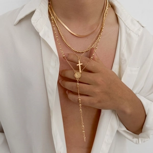 Gold layered necklace for men featuring snake chain, cross pendant and religious medallion