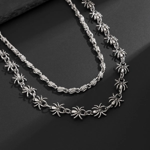 Macro detail of silver spider link chain with punk gothic metal aesthetic