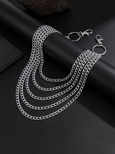 Macro detail of multi-layer silver metal pants chain with heavy-duty lobster clasps