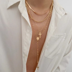 Gold-plated 4-piece layered necklace set with cross pendants and flat snake chain
