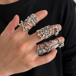 Gothic 10-piece skull ring set with punk elements in vintage silver finish on hand
