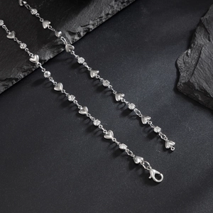 Detailed view of silver heart necklace with round cubic zirconia and lobster clasp