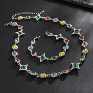 Conjunto de collar y pulsera de estrella con gemas de colores en plata antigua