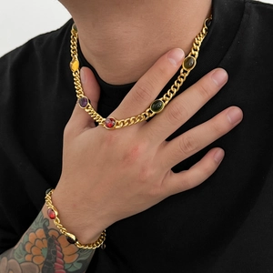 Men's gold Cuban link necklace and bracelet set with vibrant multi-colored gemstones