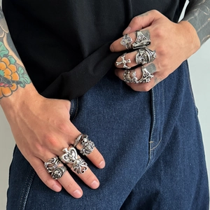 Men's retro gothic punk ring set featuring skull, octopus and cross motifs on hand