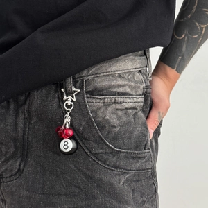 Hip hop cherry and 8-ball keychain with star clip on dark grey denim jeans