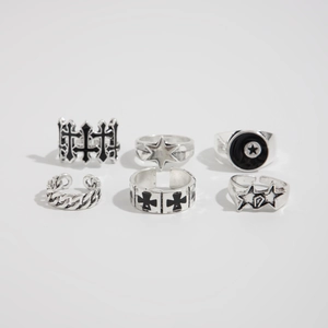 Detail of 6-piece silver ring set featuring cross and star designs in hip-hop style