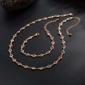 Set collana e bracciale occhio greco con ciondoli rossi in metallo dorato lucido