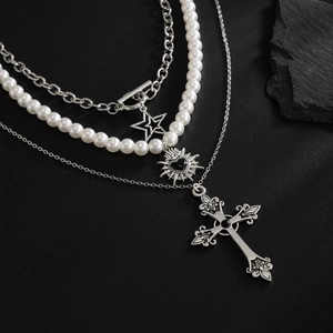 Gothic multi-layer pearl necklace with vintage cross, star, and heart pendants on black stone