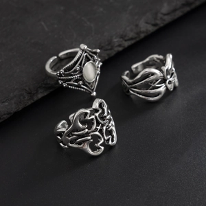 Three-piece retro silver ring set for men with hollow patterns and white gemstone inlay