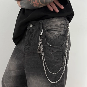Silver multi-layer punk hip-hop pants chain with skull charm on grey denim jeans