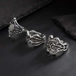 Set of three vintage silver rings with geometric diamond patterns and Gothic textures