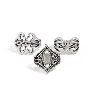 Three-piece retro silver ring set with oval gemstone and intricate filigree patterns