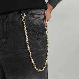 Men's hip hop pearl and gold bead trouser chain with lobster clasp on black denim
