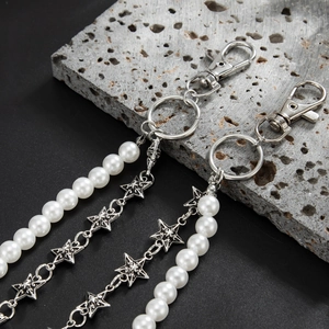 Hip hop pearl and silver star pant chain set for men on grey stone background