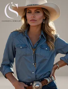 Western vintage bolo tie set with bull head pendant worn with denim shirt and a wide hat