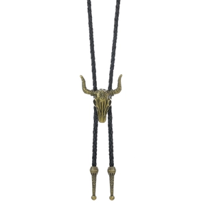 Detail of vintage bull skull Bolo Tie with flower embossing and black braided leather cord