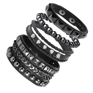 Detail of 6-piece punk bracelet set featuring leather bands, metal studs, and chain links