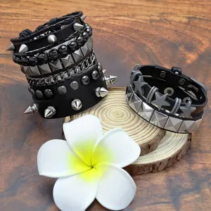 Men's punk leather bracelet set with metallic studs, spikes, and silver chains