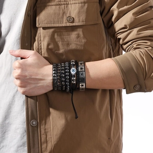 Multilayer leather bracelet set featuring evil eye charm and star studs in punk style