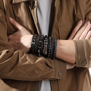 Men's 3-piece punk chain bracelet set with studs and leather bands on wrist