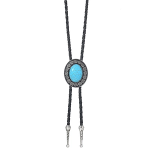 Macro detail of Celtic Bolo Tie with blue turquoise stone and engraved metal tips