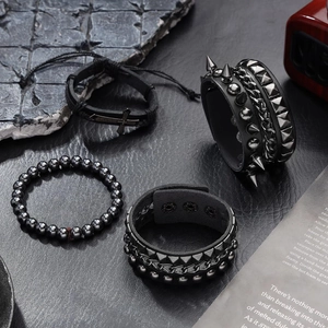 4-piece punk leather bracelet set with metal studs, cross charms and gothic spikes