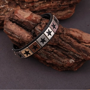 2Pcs punk leather bracelets for men with metal star studs on tree bark display