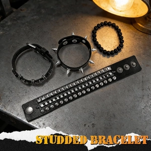 4-piece punk bracelet set with studs, chains, and beads on a vintage metal surface