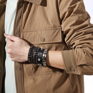 Men's punk style 4-piece bracelet set with black leather, studs, skulls and silver chains