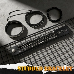Punk style multi-layer bracelet set with studded leather cuffs and matte black beads