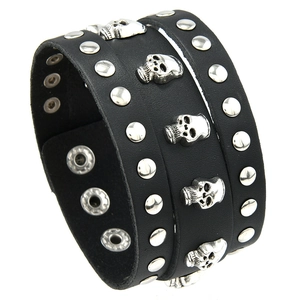 Punk rock wide black leather bracelet featuring silver skull studs and metal rivets