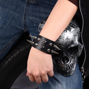 Gothic punk black leather bracelet featuring double rows of silver spikes and rivets