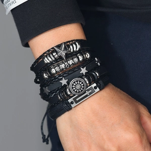 Men's punk multilayer leather bracelet set with wing and star charms on wrist