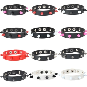 Set of 12 punk leather bracelets with colorful metallic spikes and adjustable snaps
