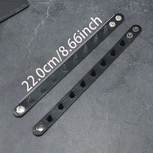 Punk leather bracelets with silver and black cone rivets featuring dual snap button closure
