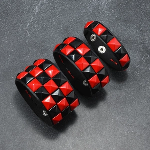Three-piece punk rock bracelet set with red and black checkered studs and metal snaps