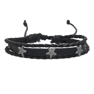 Detail of multi-layer black braided leather bracelet with silver star metal studs