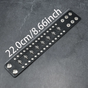 Punk black leather wide bracelet with metal skull studs and adjustable snap buttons