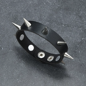 Detail of punk leather bracelet with silver metal rivets and snap-button closure