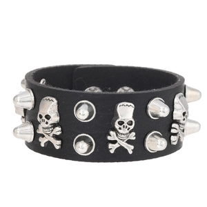 Close-up of black punk leather bracelet with silver skull and cone spike rivets