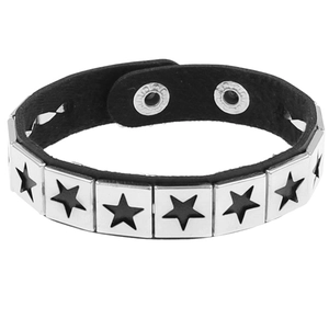 Detail of punk leather bracelet featuring star-patterned metal studs and snap buttons