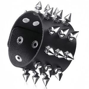 Detail view of punk leather bracelet with three rows of silver pointed metal spikes