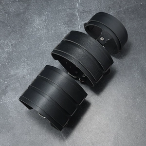 Punk style set of three black wide leather bracelets with metal buckles and rivets