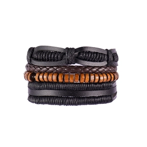 Detailed close-up of multilayer men's bracelet with braided leather and wooden beads