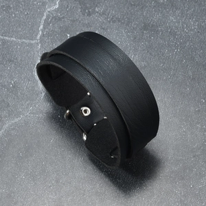 Detailed view of black wide leather punk bracelet with adjustable silver metal snaps