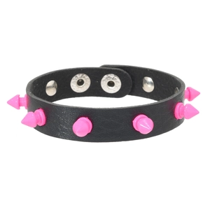 Detail of black leather punk bracelet with pink metal spikes and adjustable snap buttons