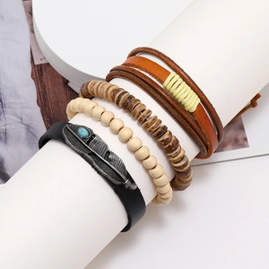 Retro multi-layer bracelet set with feather charm and turquoise beads on white stand